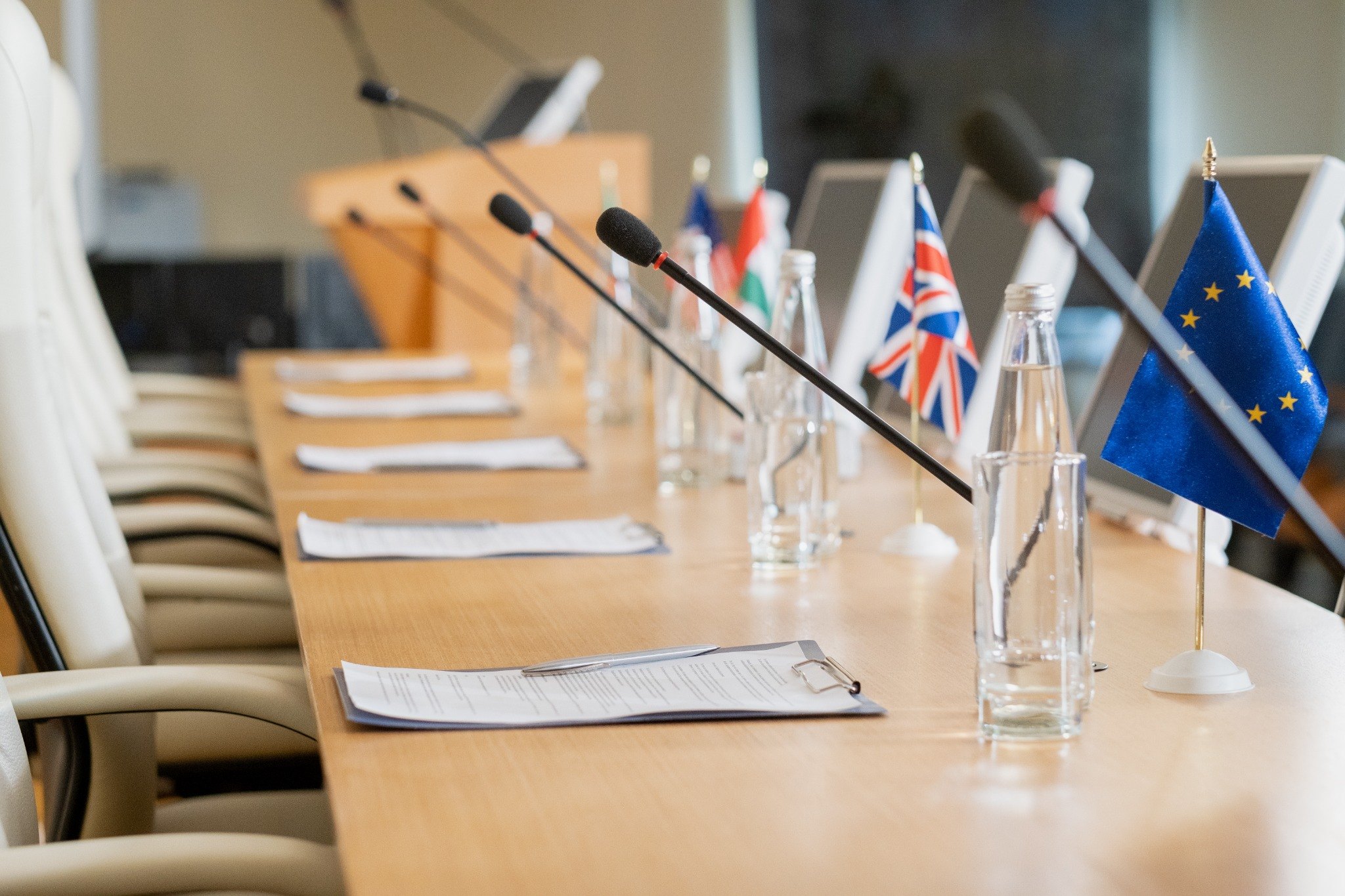 Conference room with flags and documents